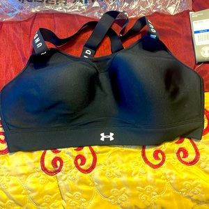 Four (4) under armour sport bras. Brand new with tags.